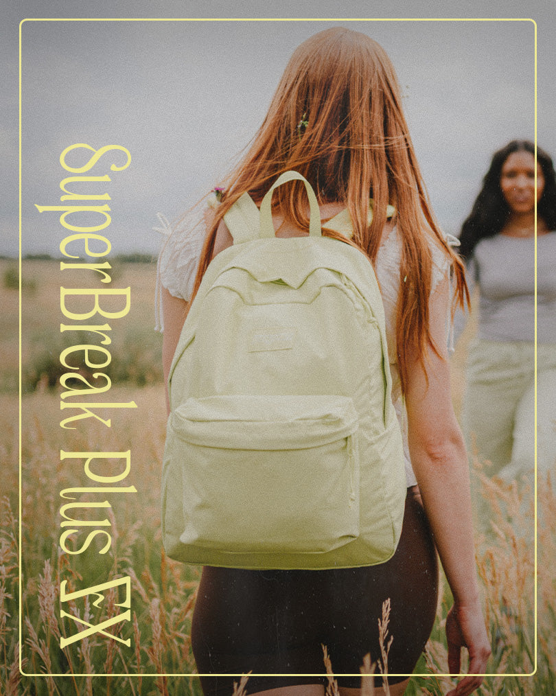 Person wearing a light yellow JanSport backpack in a field with 'SuperBreak Plus EX' text overlay.